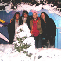 The band, post gig outside the tour bus in Trento